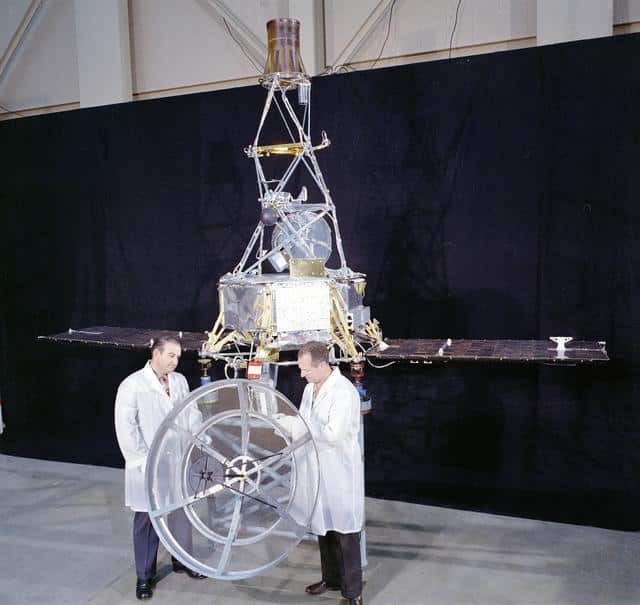 Two scientists viewing some equipment